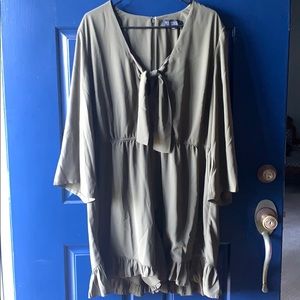 Army green romper with ruffled details